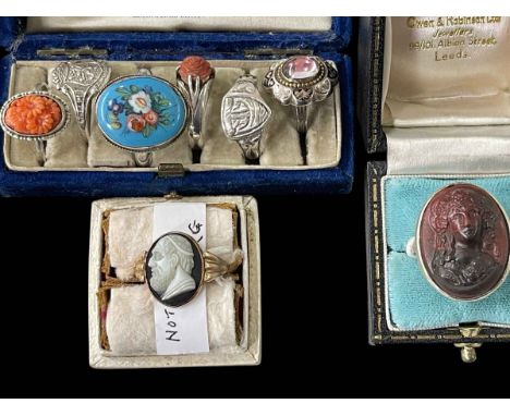 Six silver rings, two with coral and two cameo rings (8).