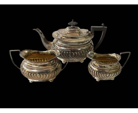 Silver three-piece part fluted tea set, Sheffield 1896.