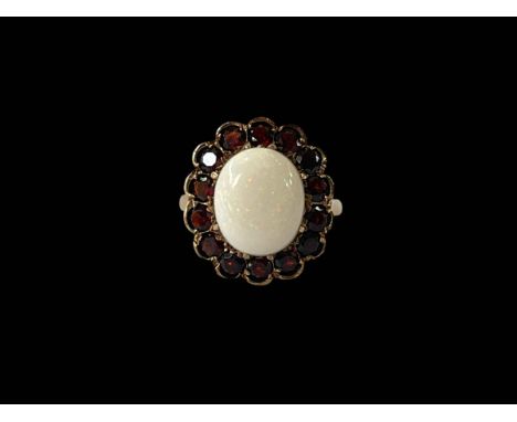 Opal and garnet 9ct gold ring, size M.
