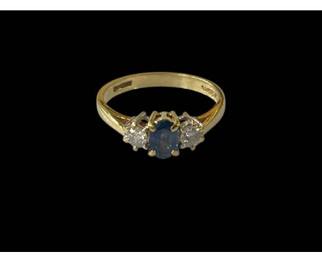 Sapphire and diamond three-stone 18ct gold ring, size L/M.