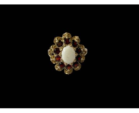 Opal and garnet 9ct gold fancy set ring, size K.