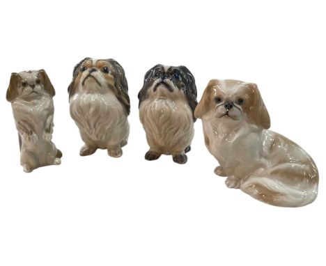 Two Dahl Jensen Pekingese Dogs No 1003, Royal Copenhagen Seated Pekingese No 1772 and Pekingese on Hind Legs No 1776.