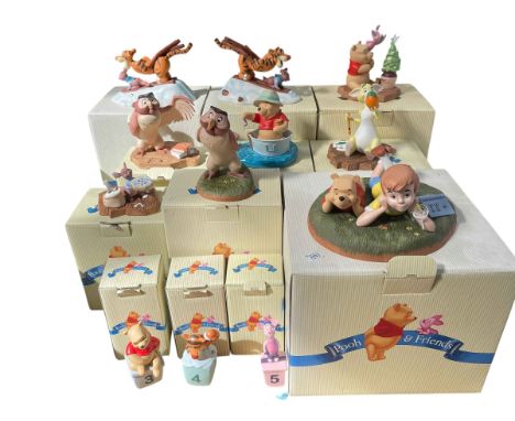 Collection of twelve Disney Pooh and Friends with boxes.