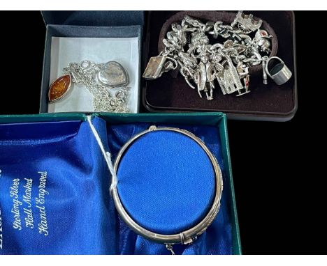 Silver charm bracelet, silver bangle, amber and heart pendants (4).