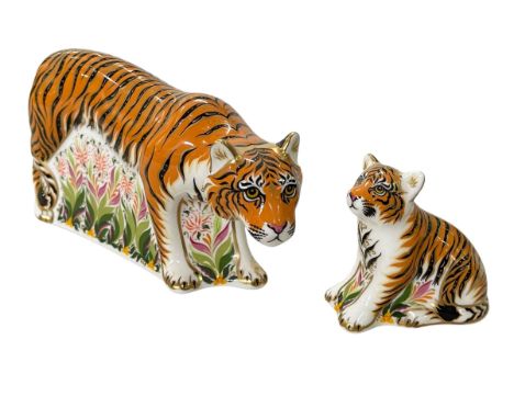 Two Royal Crown Derby Sumatran Tigress and Cub paperweights, gold stopper, largest 19cm across.