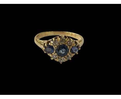 Sapphire and diamond 18ct gold cluster ring, size L.