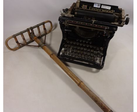 Early 20th Century 'Underwood' typewriter and an early 20th Century bamboo shooting stick Condition Report Click here for fur