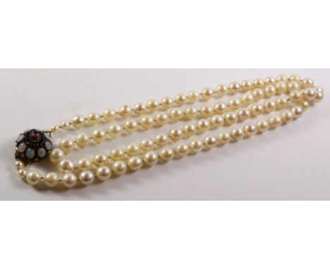 Cultured pearl necklace with opal and amethyst set clasp stamped 18k, 80cm Condition Report Click here for further images, co