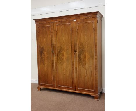 Early 20th century walnut triple wardrobe with fitted interior on bracket feet, W177cm, H200cm, D56cm Condition Report Click 