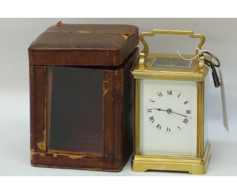 20th century French Brass carriage clock with white dial, twin train movement striking the half hours on a gong, dated 1934, 