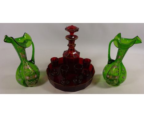 Pair of Victorian glass jugs with enamelled finish and a Victorian ruby glass decanter set  Condition Report Click here for f