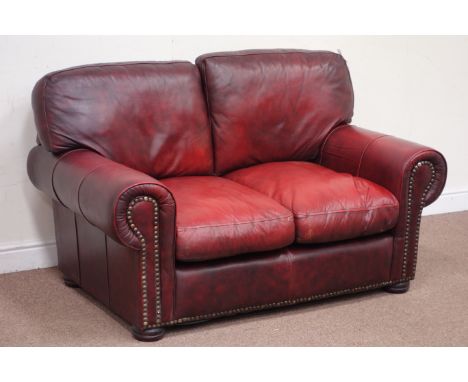 Small two seat traditional red leather sofa, W144cm Condition Report Click here for further images, condition, auction times 