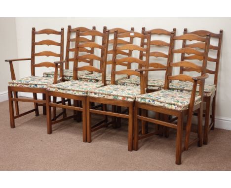 Set of eight Ercol ladder back dining chairs including two elbow chirs with loose seat pads (8) Condition Report Click here f