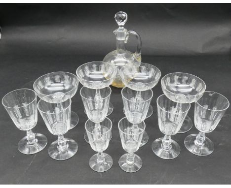 A collection of antique hand cut crystal cross hatched design glasses and decanter. Including four champagne coupes, six smal