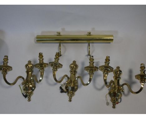 A set of three heavy solid brass Dutch style wall candelabras and a brass wall picture light. H.31cm 