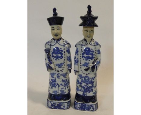 A pair of Chinese ceramic blue and white male standing figures, character marks to the base. H.38cm 