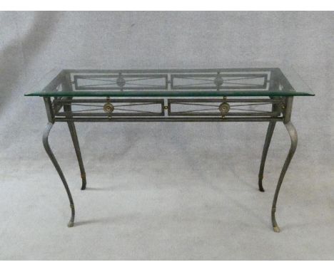 A metal framed Romanesque style console table with plate glass top on cabriole supports. H.77xW.122xD.41cm 