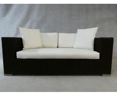 A woven style brown terrace sofa in waterproof materials for outside use. H.72xW.174xD.87cm