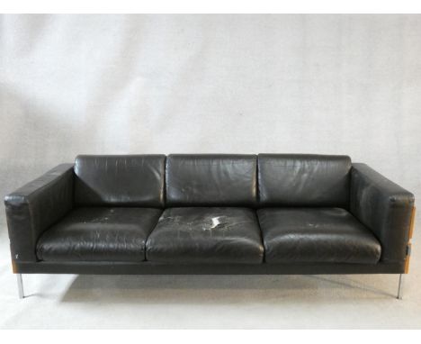 A Robin Day Forum style three seater sofa by Habitat in black leather. H.72 W.206 L.82cm (one cushion damaged as photographed