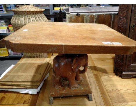 Mid 20th century teak lamp table, with carved elephant support, 68 x 53 x 51cm H, for restoration. Not available for in-house