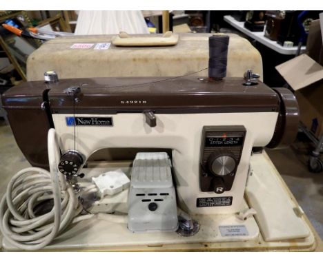 Cased New Home sewing machine. All electrical items in this lot have been PAT tested for safety and have passed. This does no