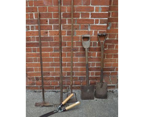 Garden tools to include, two spades, hoe, rake, multi-tool and shears