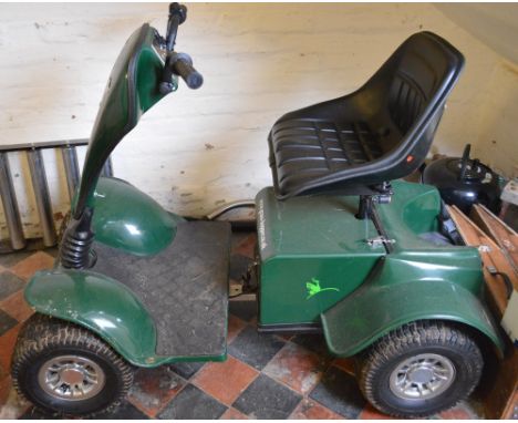 A Grass-Hopper Junior golf buggy Classic with owner's manual, battery and charger