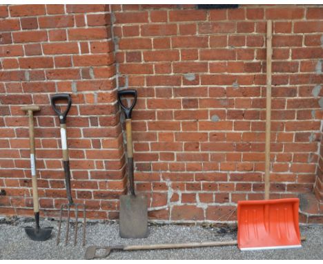 A garden edger, fork, spade, hoe, snow shovel etc