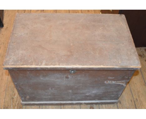 A small wooden trunk and a small black painted bookcase