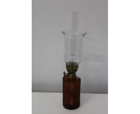 An unusual oil lamp with an amber glass reservoirh44cm 