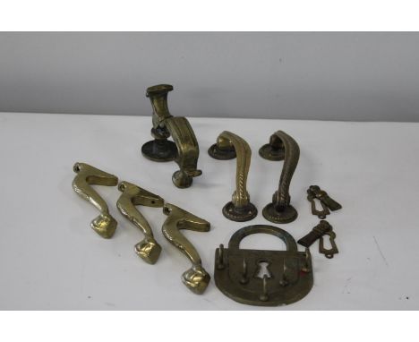 A selection of vintage brass door handles, and door knocker etc 