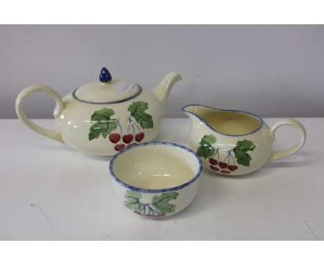 A Poole pottery teapot, sugar bowl &amp; cream jug 