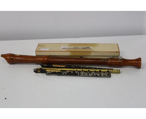 A vintage boxed Adler tenor recorder and tin penny whistles 