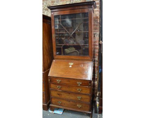 A George III mahogany bureau bookcase, the single astragal glazed door enclosing adjustable shelves over a fall front and fou