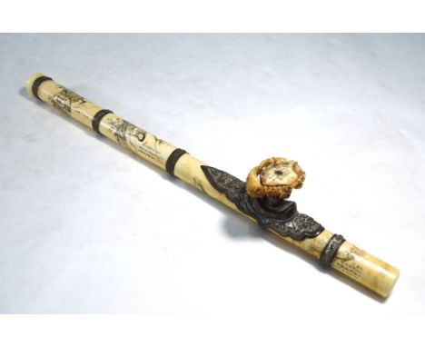 A Vietnamese ivory opium pipe with finely-chased and embossed white metal mounts, the bowl carved as a crab, the body incised