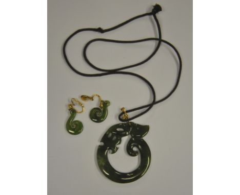 A New Zealand jade carved Tiki to/w a pair of similar earrings