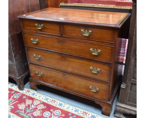 A George III mahogany chest of two short over three long graduated drawers, raised on shaped bracket feet, 96 x 51 x 87 cm hi