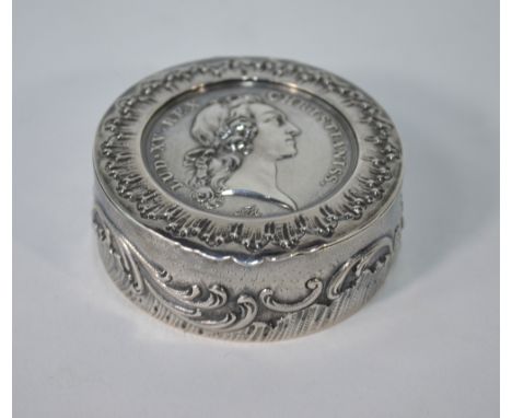 A French circular white metal snuff box, the hinged cover inset with a 1745 Louis XV medallion, commemorating the Marriage of