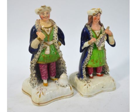 Two 19th century Staffordshire figures of Ottoman Turks - the lady playing a musical instrument, 15.5 cm high (2) Condition R