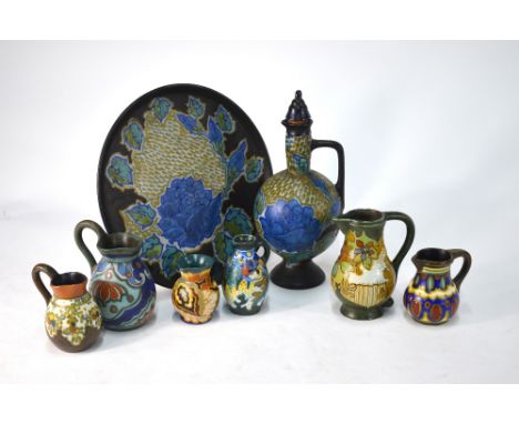 Gouda, Holland - A decanter and stopper with matching circular tray to/w six small jugs (8) Condition Report Crazed glaze on 