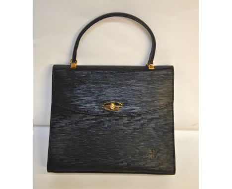 A vintage Louis Vuitton black epi grenelle leather handbag with suede lined inner zipped section, the gilded zip pull with LW