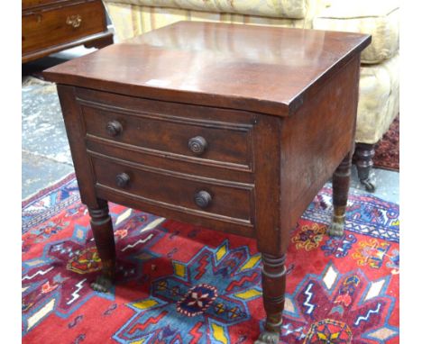 A Regency mahogany box commode with double false drawer front, on turned supports and cast brass lion-paw feet