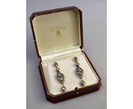 A pair of Edwardian diamond set drop earrings, rose and eight cut diamond set overall, gold and silver set, for pierced ears,