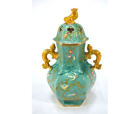 An English early 19th century Chinoiserie hexagonal pottery pot pourri vase moulded with bird and foliate decoration, interna