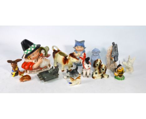 A collection of early Goebel wares including 'Little Mother Goose' wall plaque, model of a poorly dog, cow creamer, Scottie d