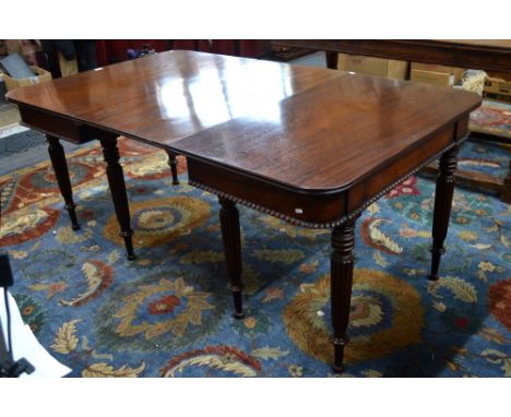 A compact George IV mahogany dining table, the pair of reeded leg end tables united by a single insert leaf, 173 max (53 cm l