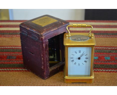 A late 19th century French gilt brass carriage clock, the 8-day two-train movement striking the hours on a coiled gong, with 