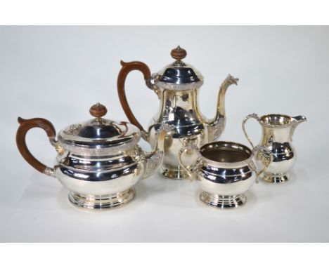 A heavy quality silver four-piece tea/coffee service with Celtic strapwork designs, dragons' head spouts and raised moulded f