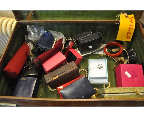 A collection of assorted fashion jewellery in small suitcase, including chains, necklaces, Pia necklace and peacock bangle, c