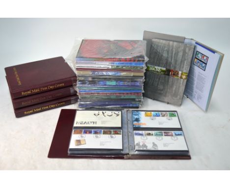 Four albums of Royal Mail first day covers (approx 250) to/w nineteen New Zealand Post Annual stamp year-books